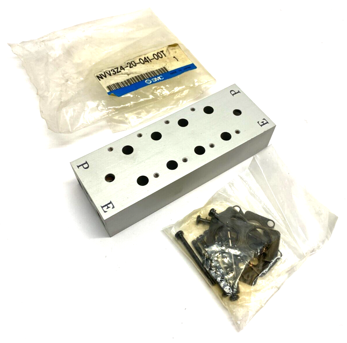 NVV3Z4-20-041-00T | SMC Pneumatic Manifold Block 4-Station 3-Port - New – Open box - Maverick Industrial Sales