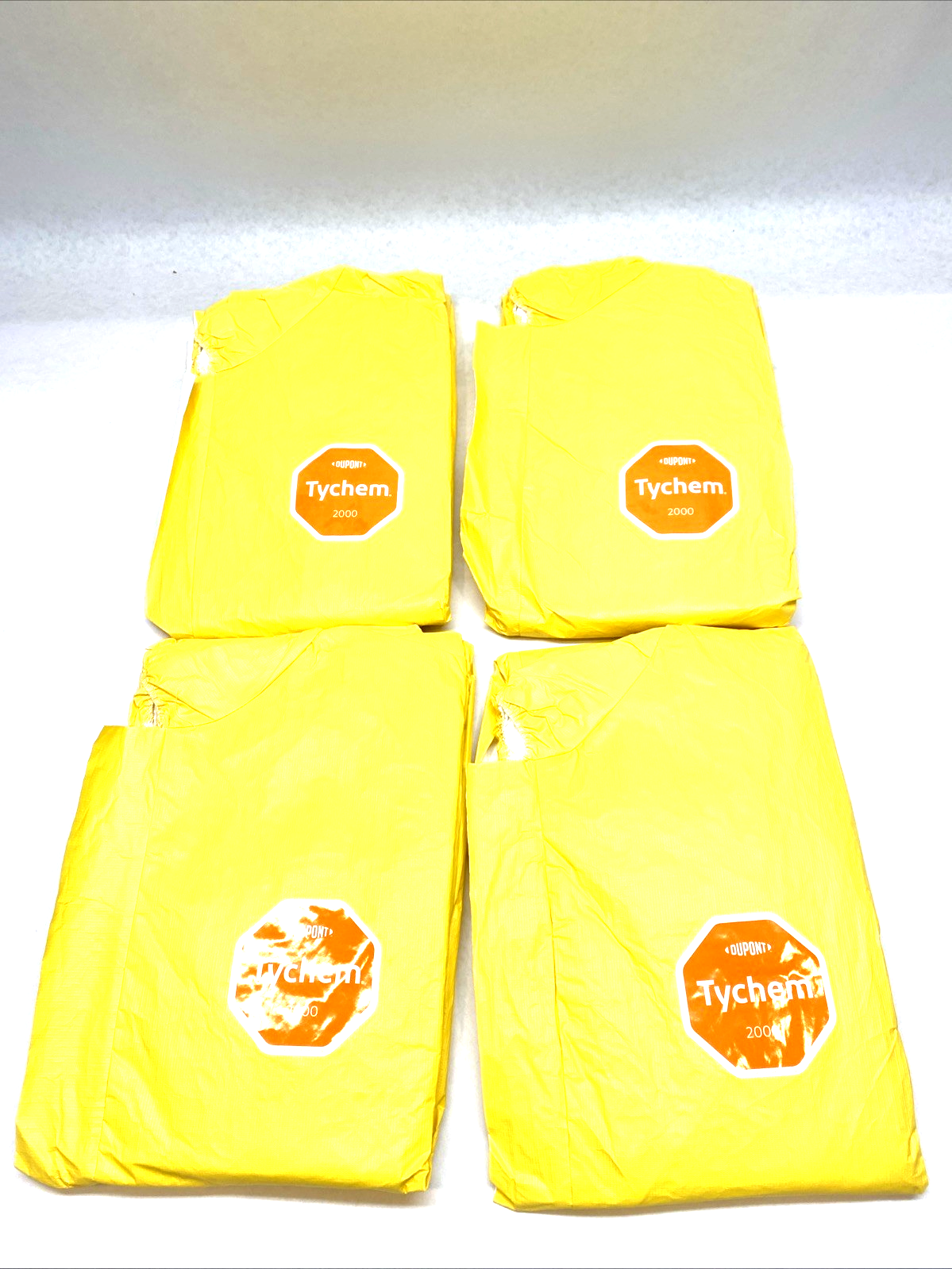 QC127SYLXL001200 | DuPont Tychem 2000 Coverall XL Yellow Attached Hood LOT OF 4 - New - Maverick Industrial Sales