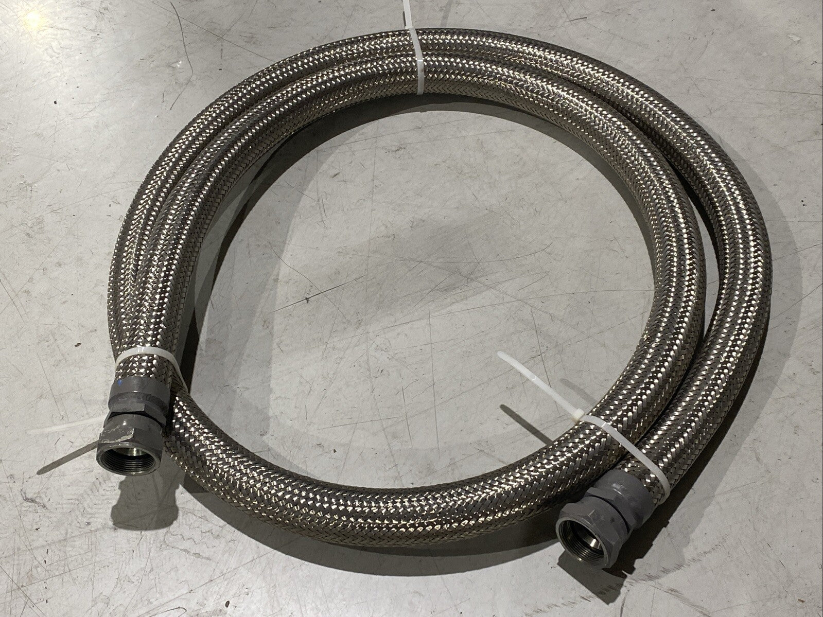 Braided Flexible Hose 2" Wide 12ft Length 1-3/4" NPT Female Connectors - Maverick Industrial Sales