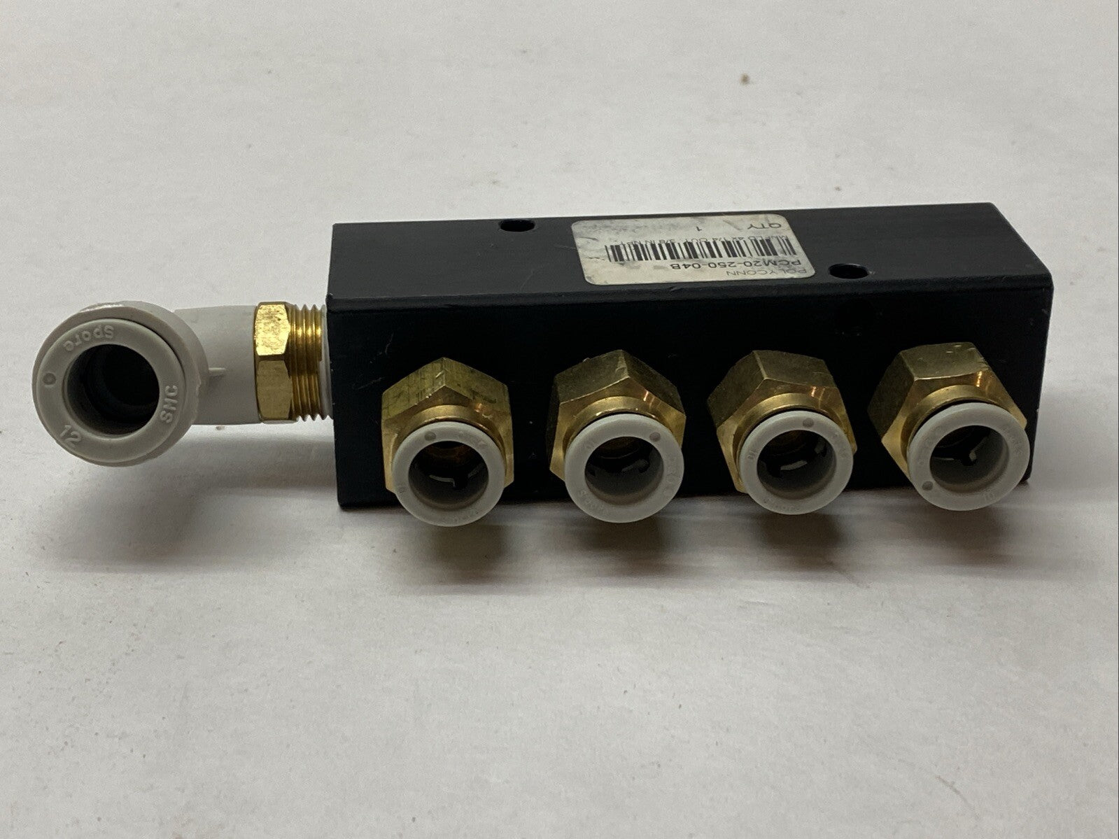 Polyconn PCM20-250-04B Pneumatic Manifold, 4x 1/4" NPT Out , 3/8"NPT IN - Maverick Industrial Sales