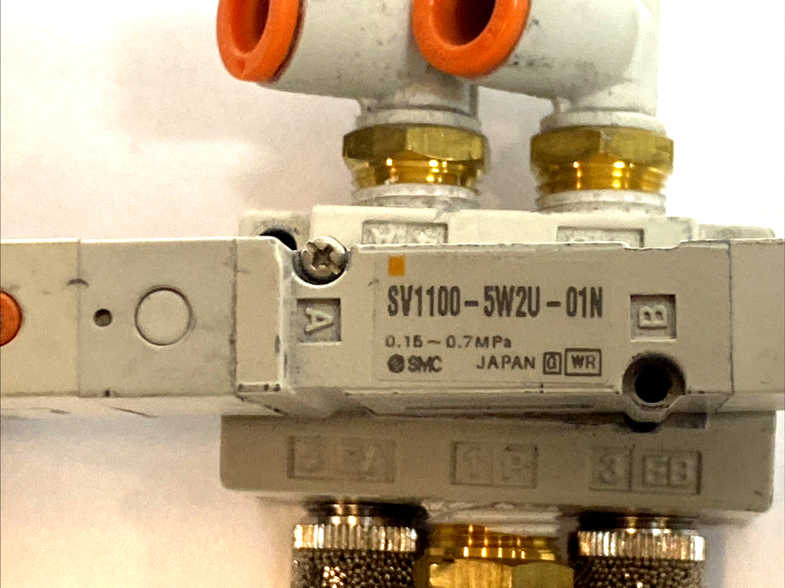 SV1100-5W2U-01N | SMC 5‑Port Solenoid Valve 2‑Position Single 24VDC MISSING SCREW - Used - Maverick Industrial Sales