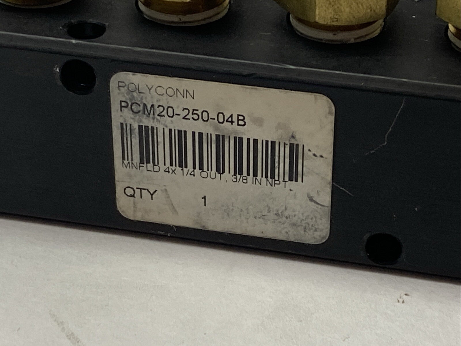 Polyconn PCM20-250-04B Pneumatic Manifold, 4x 1/4" NPT Out , 3/8"NPT IN - Maverick Industrial Sales