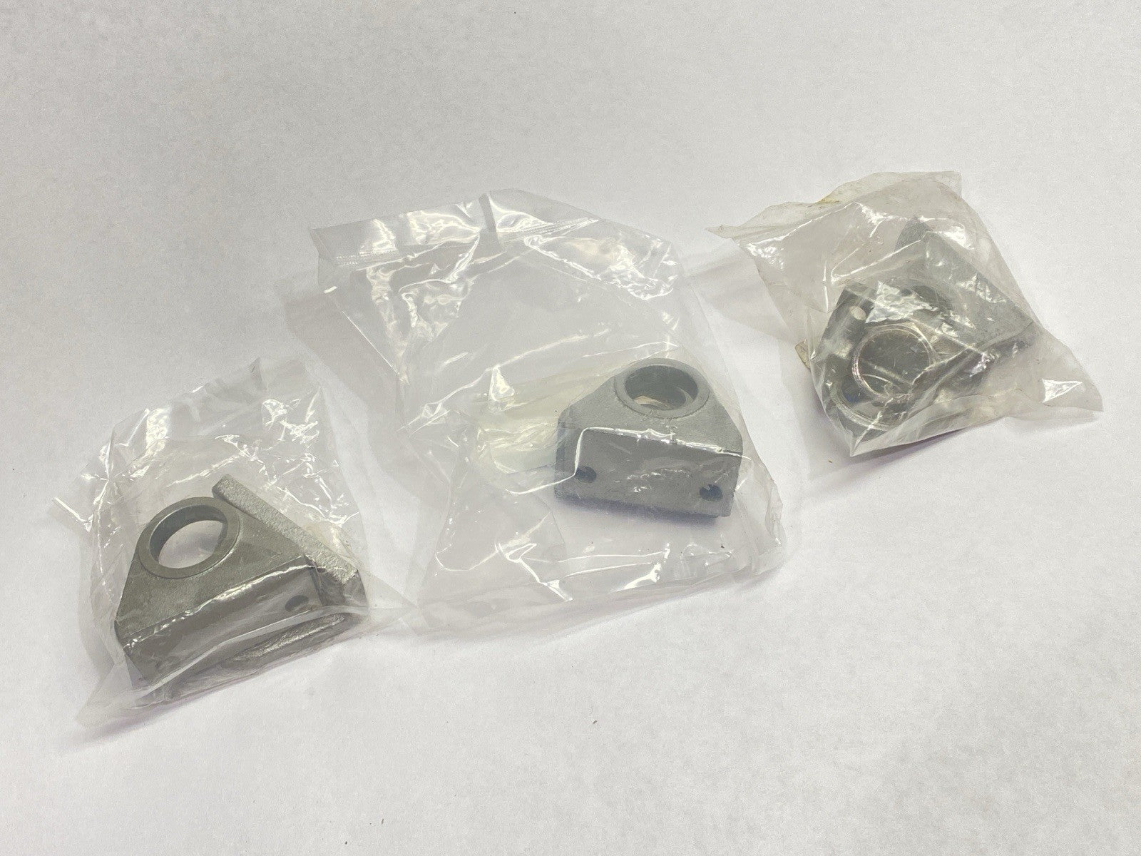 RHC-L020 | SMC Pneumatic Cylinder Foot Bracket LOT OF 3 - New - Maverick Industrial Sales