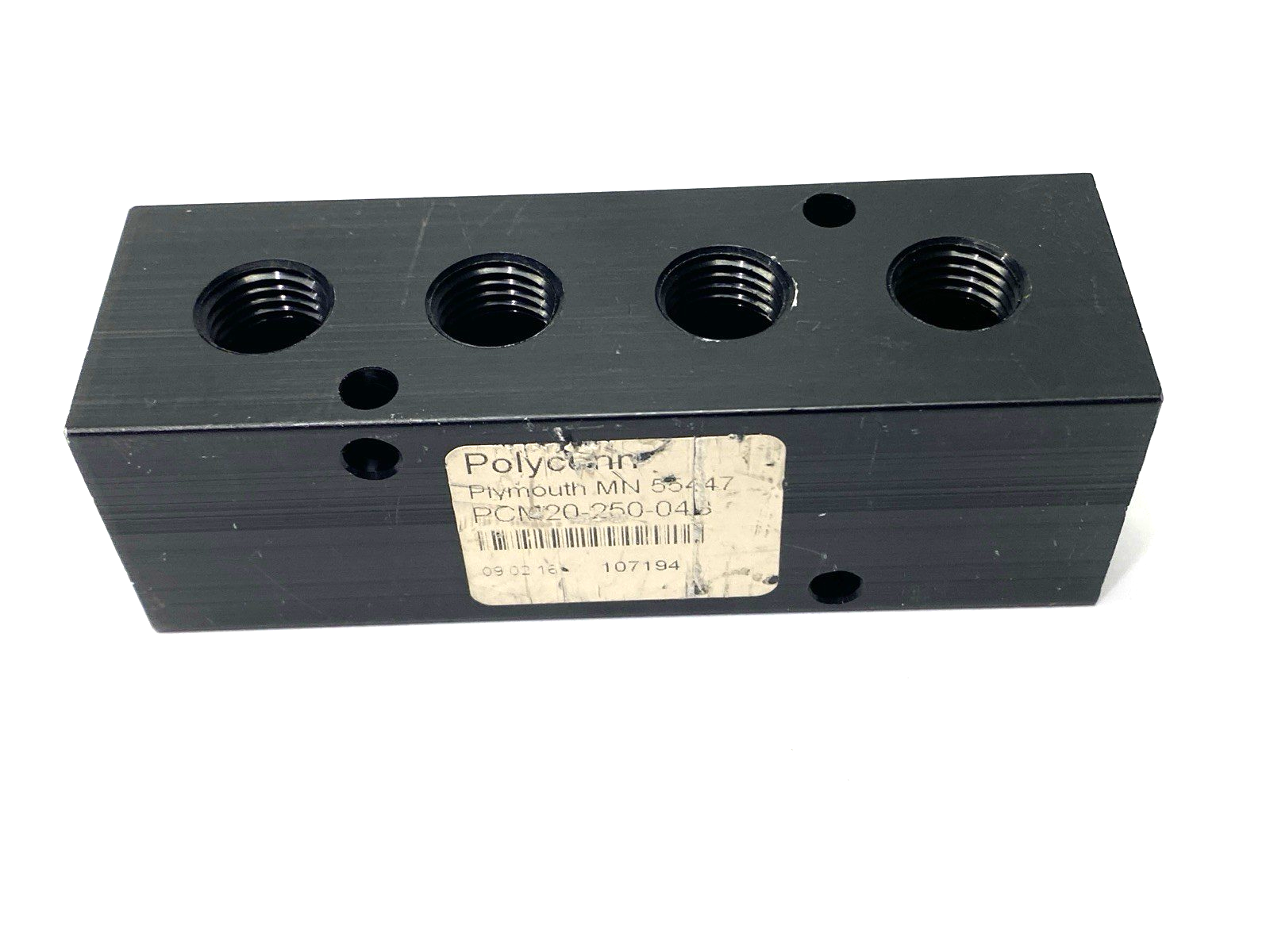 PCM20-250-04B | Polyconn Pneumatic Manifold 4x 1/4" NPT Out 3/8"NPT In - Used - Maverick Industrial Sales