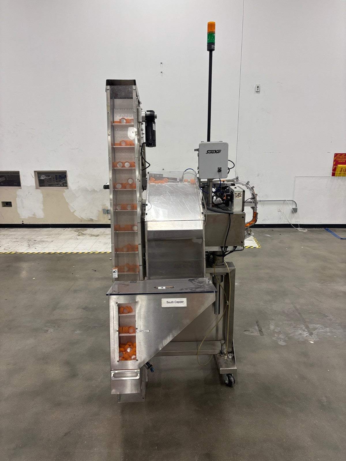SK6000-BF6 | SureKap 6-Quill Capping Machine and Elevator, Capper - Used - Maverick Industrial Sales