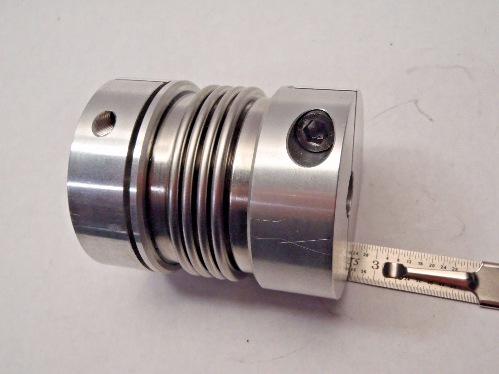 195770 Coupling 2-1/8"OD 7/8"ID 1/4"Key 1/2"ID 1/8" Key 2-5/8"L Alum/ SS Bellows - New Other - Maverick Industrial Sales