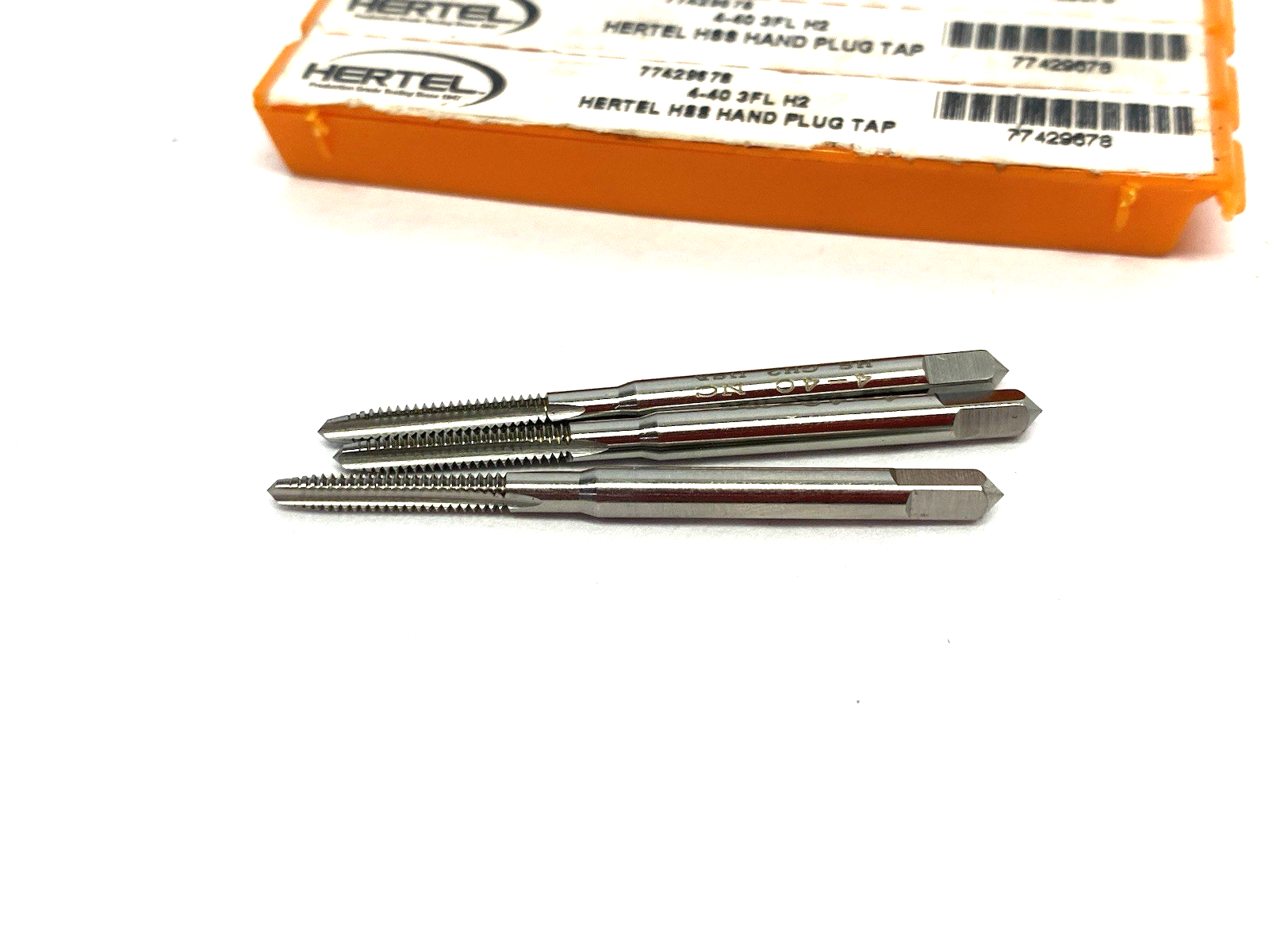 77429678 | Hertel Straight Flute Tap: #4-40 UNC, 3 Flute, Plug Chamfer, LOT OF 3 - New – Open box - Maverick Industrial Sales