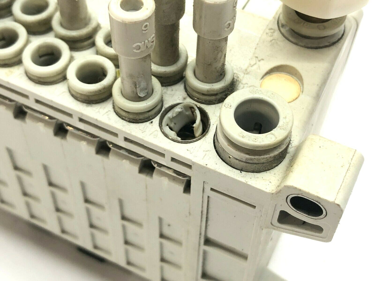VV5QC11-08C6FD0 | SMC Manifold Base w/ Solenoids - For parts or not working - Maverick Industrial Sales
