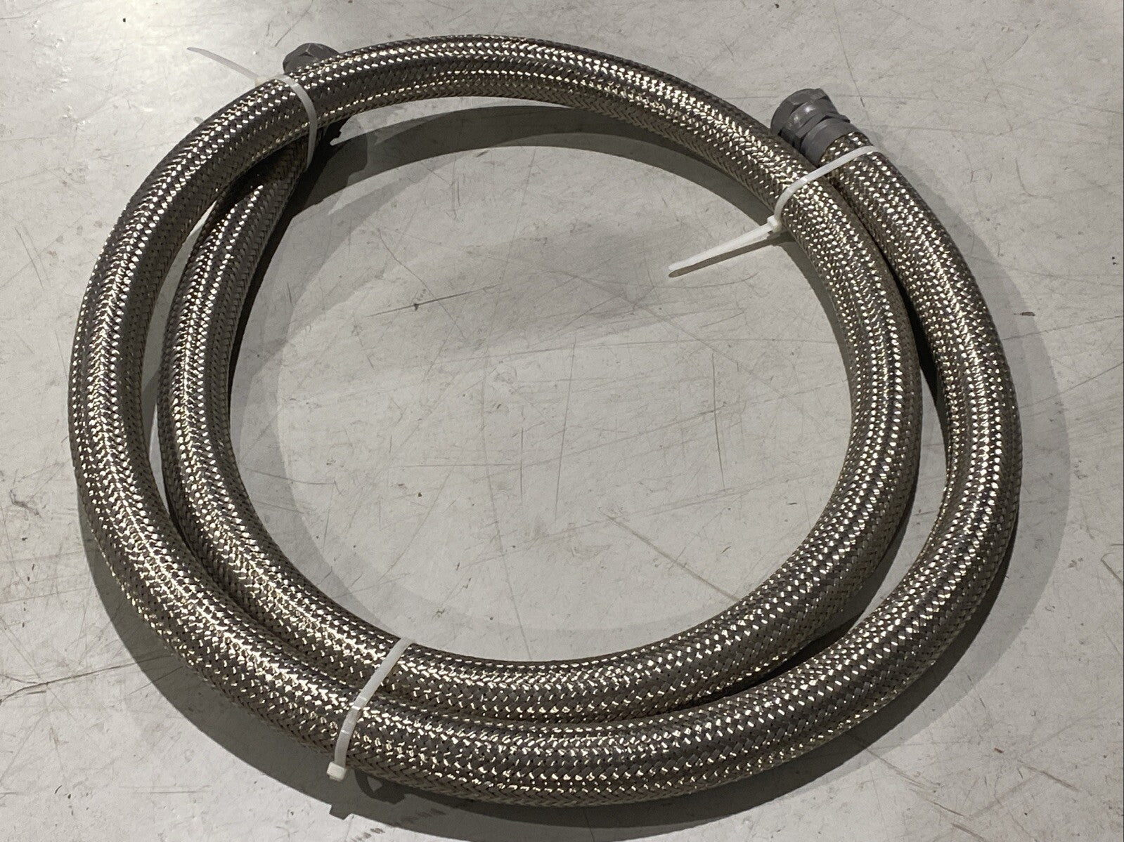 Braided Flexible Hose 2" Wide 12ft Length 1-3/4" NPT Female Connectors - Maverick Industrial Sales