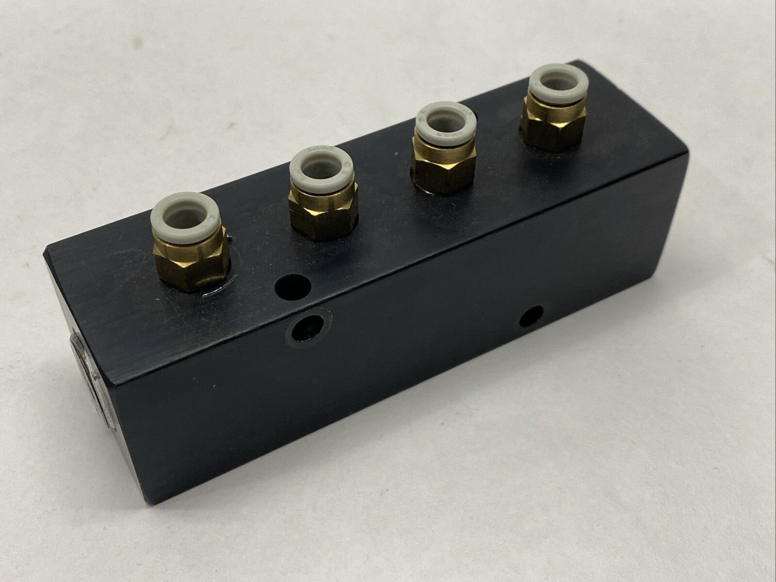 Polyconn PCM20-125-04B Pneumatic Manifold 4x 1/8" NPT Out 3/8" NPT In - Maverick Industrial Sales