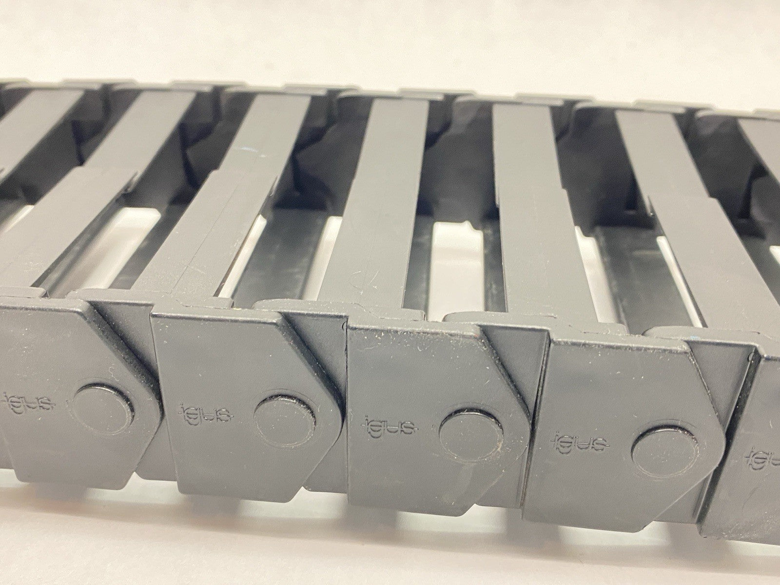 E16.7.060 | Igus E-Chain Assembly 17-Links 1.7ft Length w/ 117.7.P End Bracket - Used - Maverick Industrial Sales