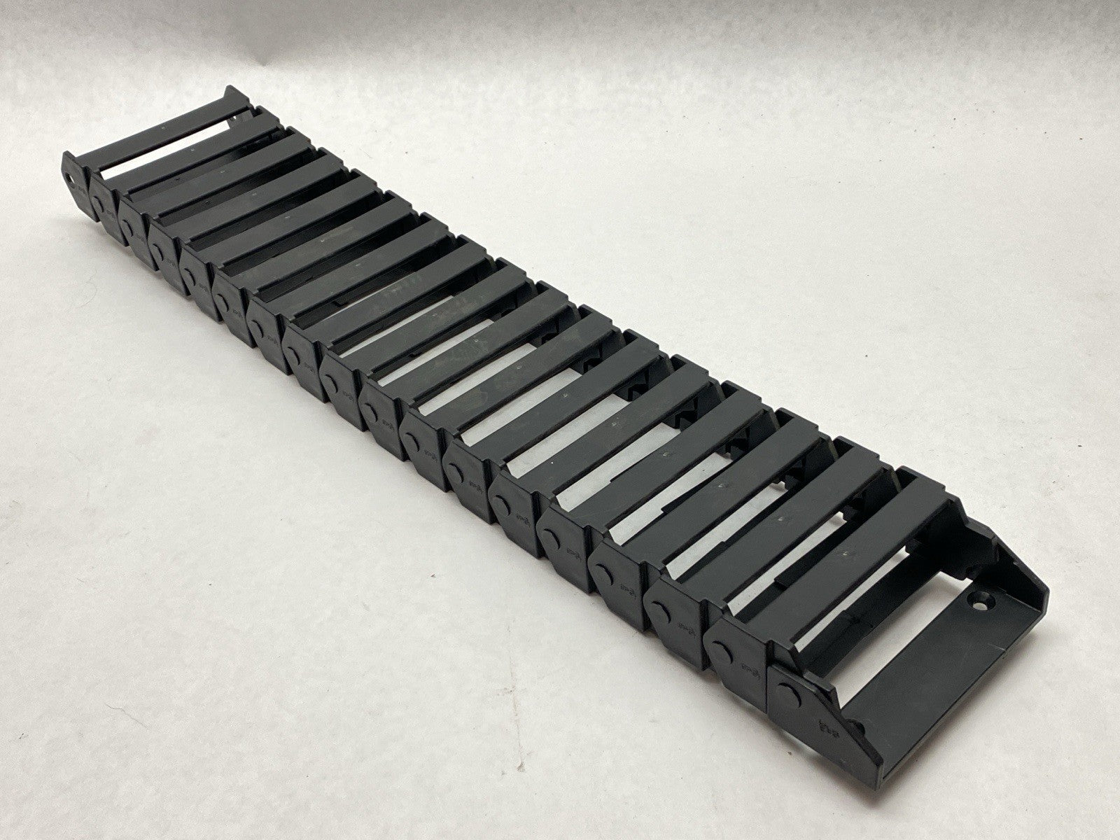 E16.7.060 | Igus E-Chain Assembly 17-Links 1.7ft Length w/ 117.7.P End Bracket - Used - Maverick Industrial Sales