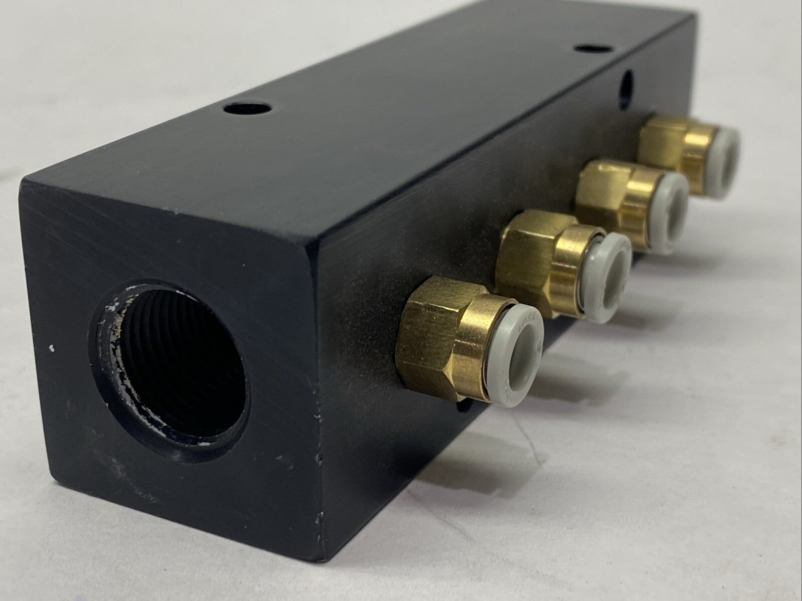 Polyconn PCM20-125-04B Pneumatic Manifold 4x 1/8" NPT Out 3/8" NPT In - Maverick Industrial Sales